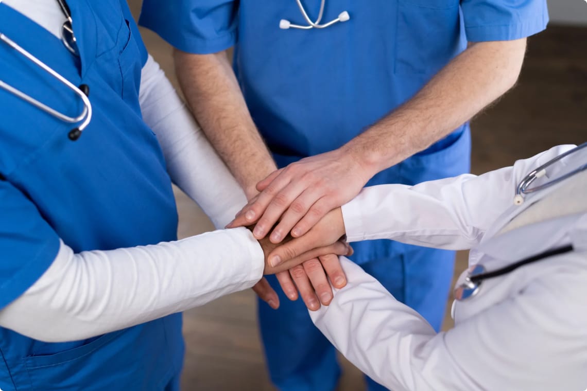 Doctors holding hands